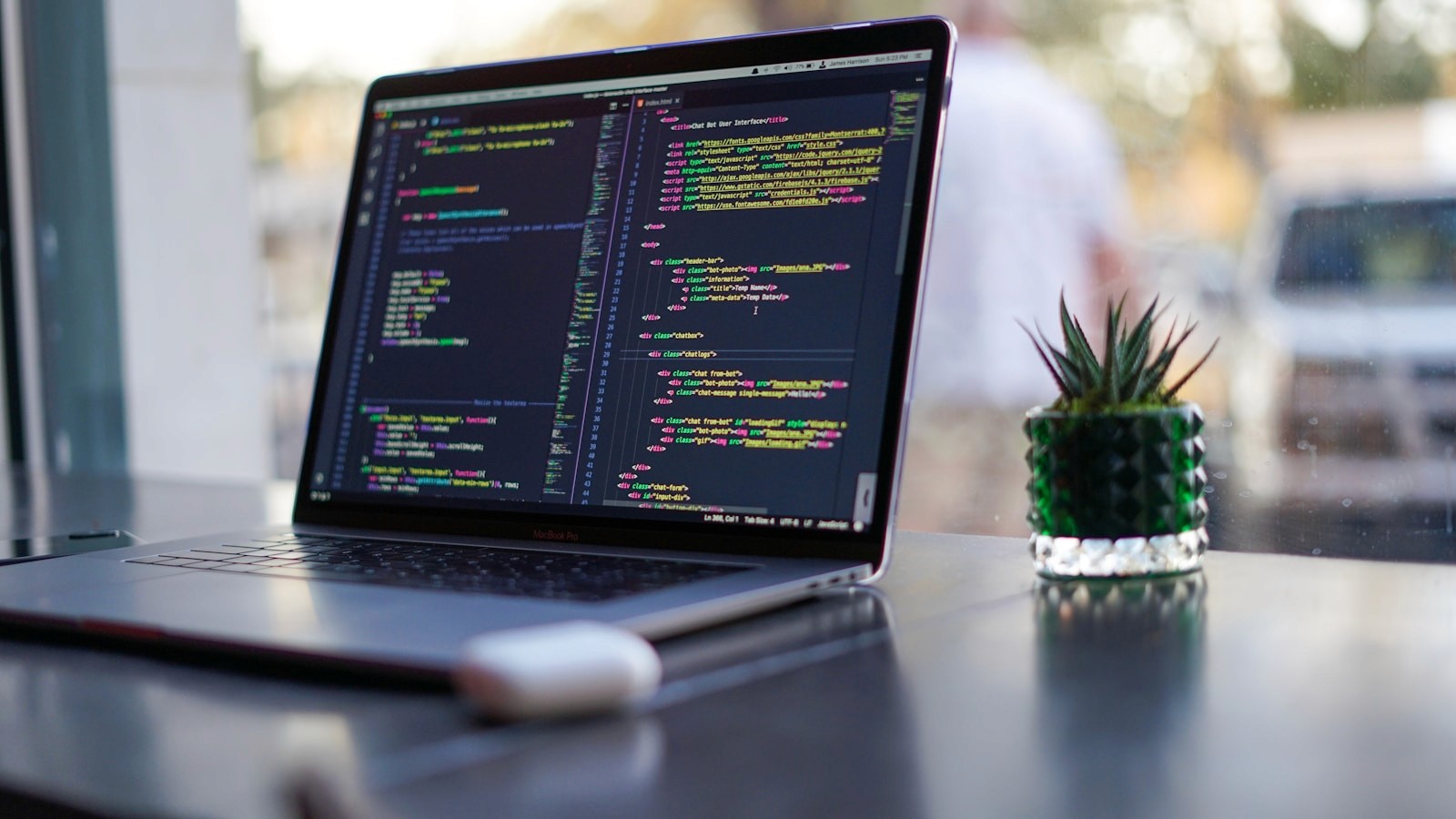 Developer workspace with a laptop open to code, representing terminal-first productivity