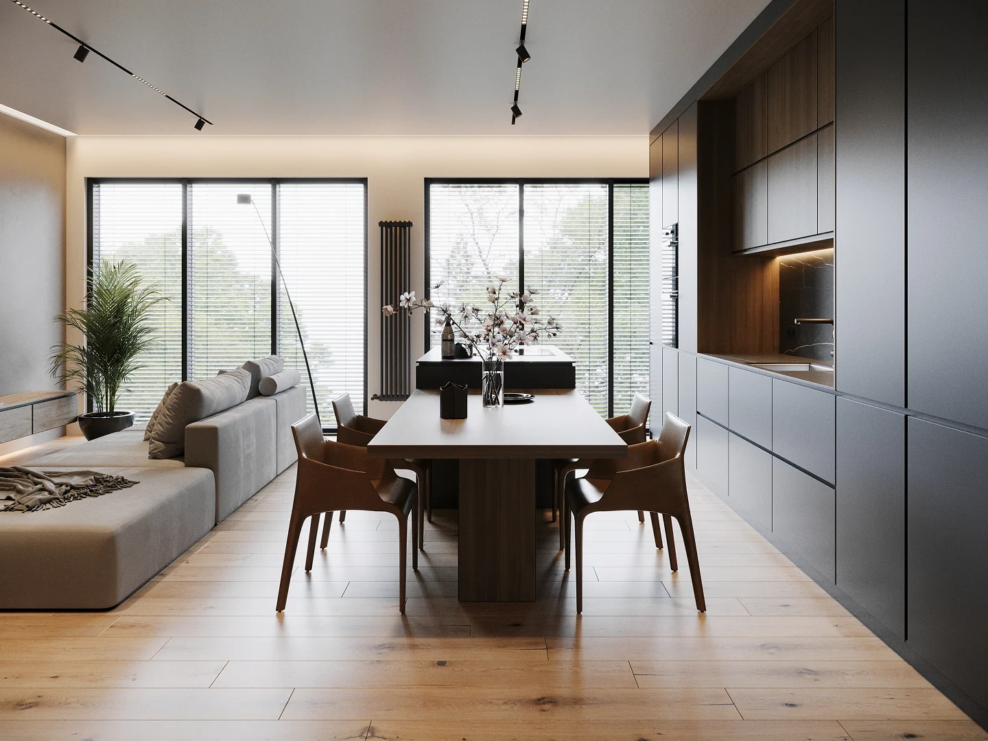 Mur en pierre du salon avec éclairage rasant chaud.