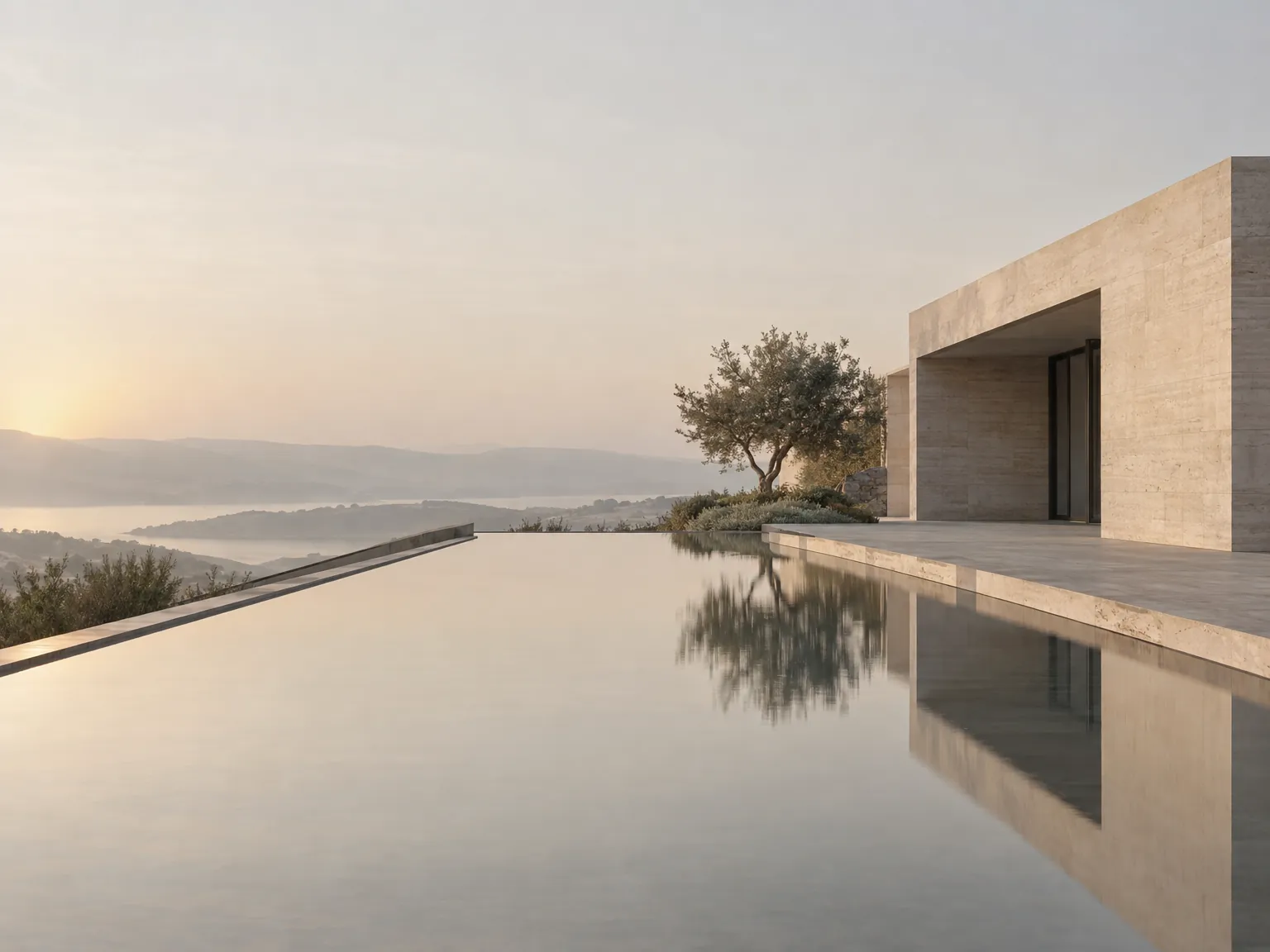 Still reflecting pool in front of a minimal stone building at dawn