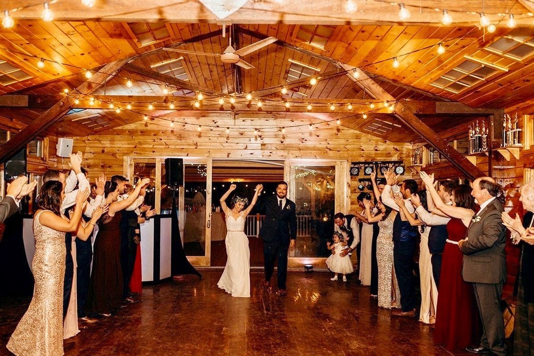 Wedding guests dancing in the lodge at Camp Lenox
