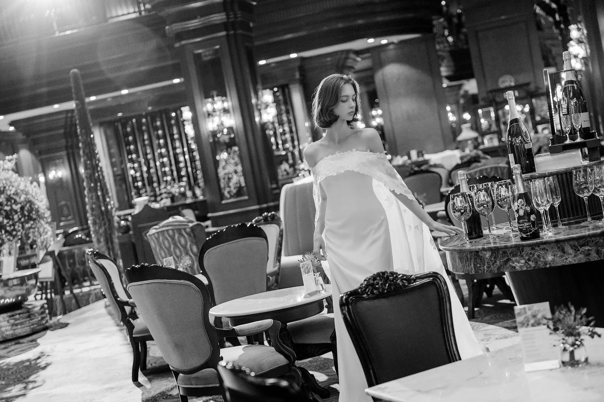 HOUSE OF AMY bride in a black-and-white hotel dining room portrait.