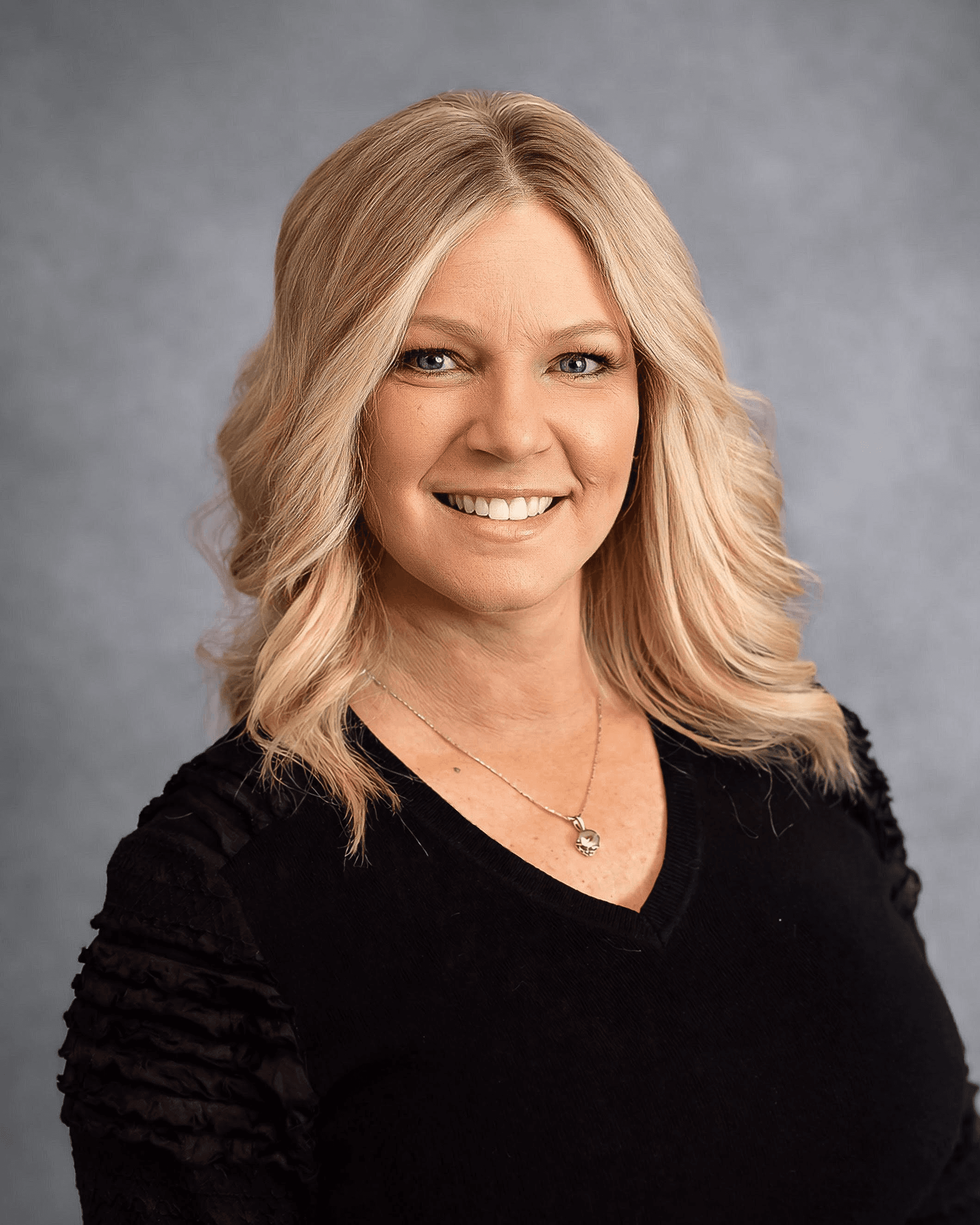 Professional headshot of Melanie Royer, Licensed Physical Therapist providing expert rehabilitation services.