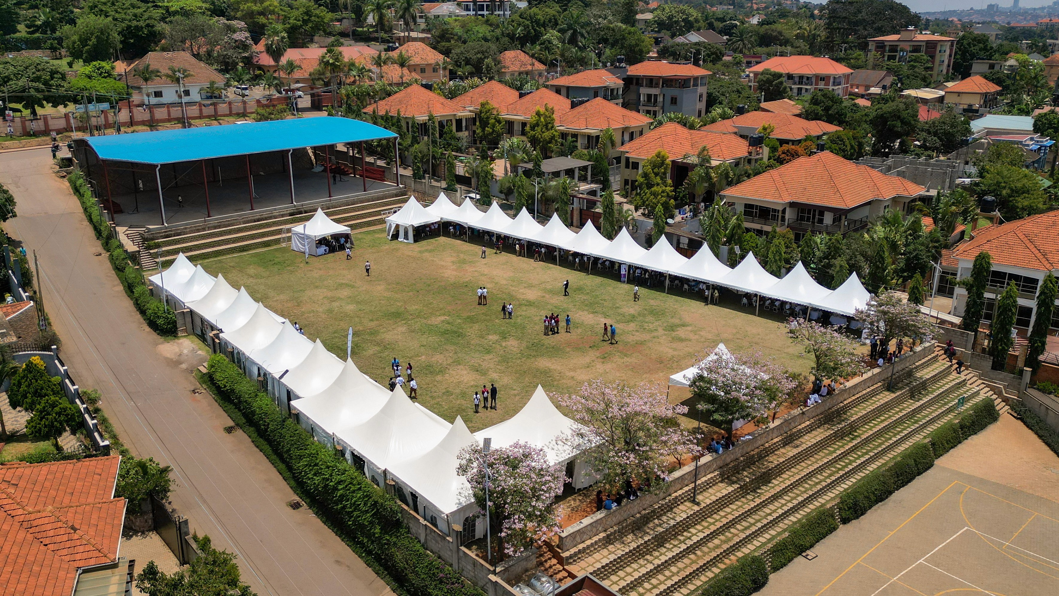 A schoolgirl participates in an online lesson using a tablet