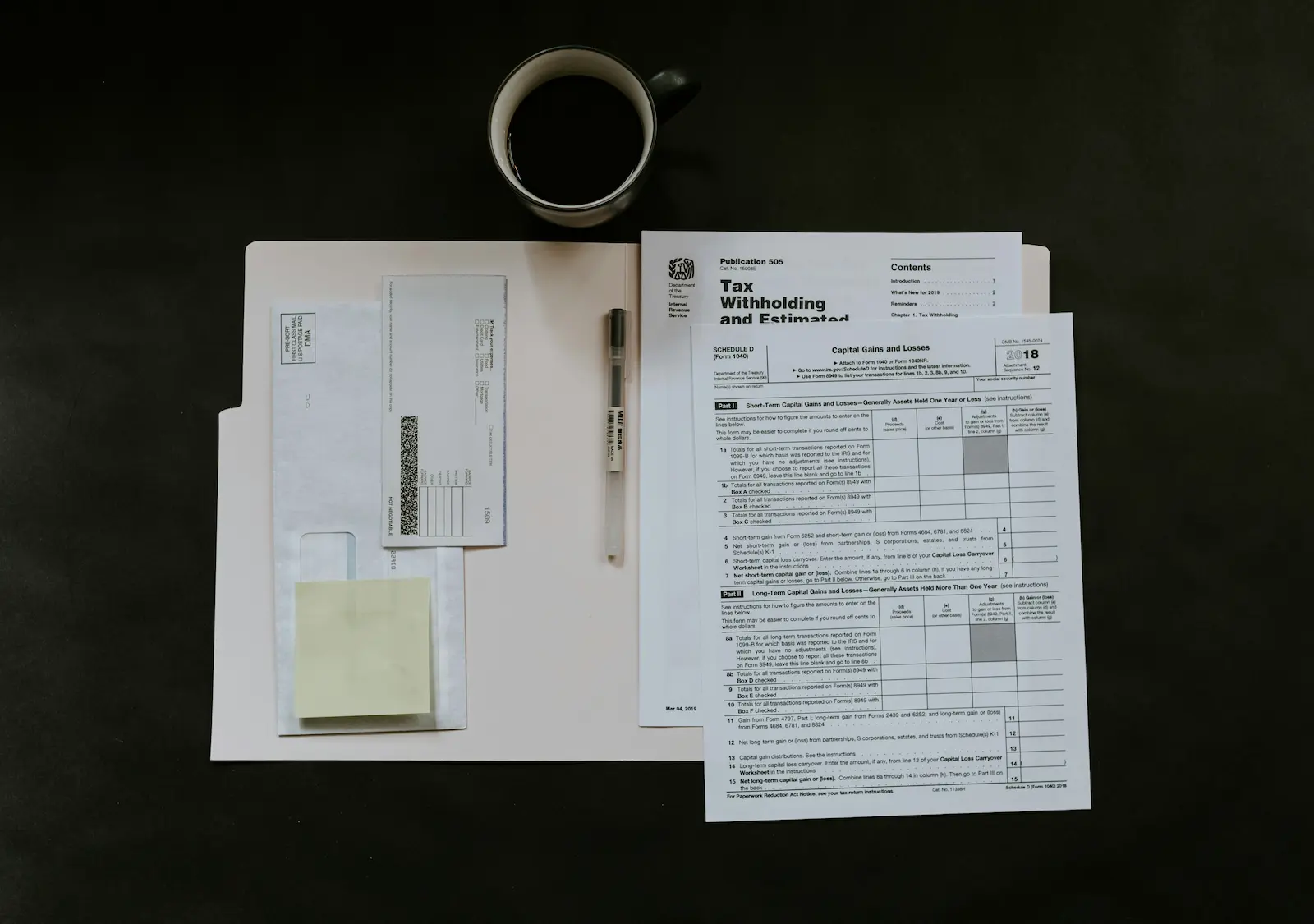 Desk with official-looking forms and mail, suggesting an intake or administrative process