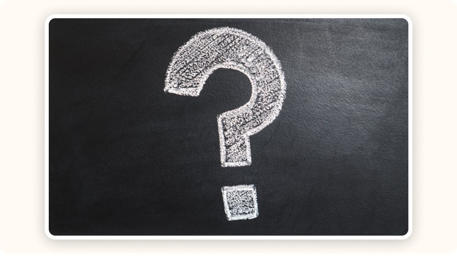 Chalk question mark on blackboard