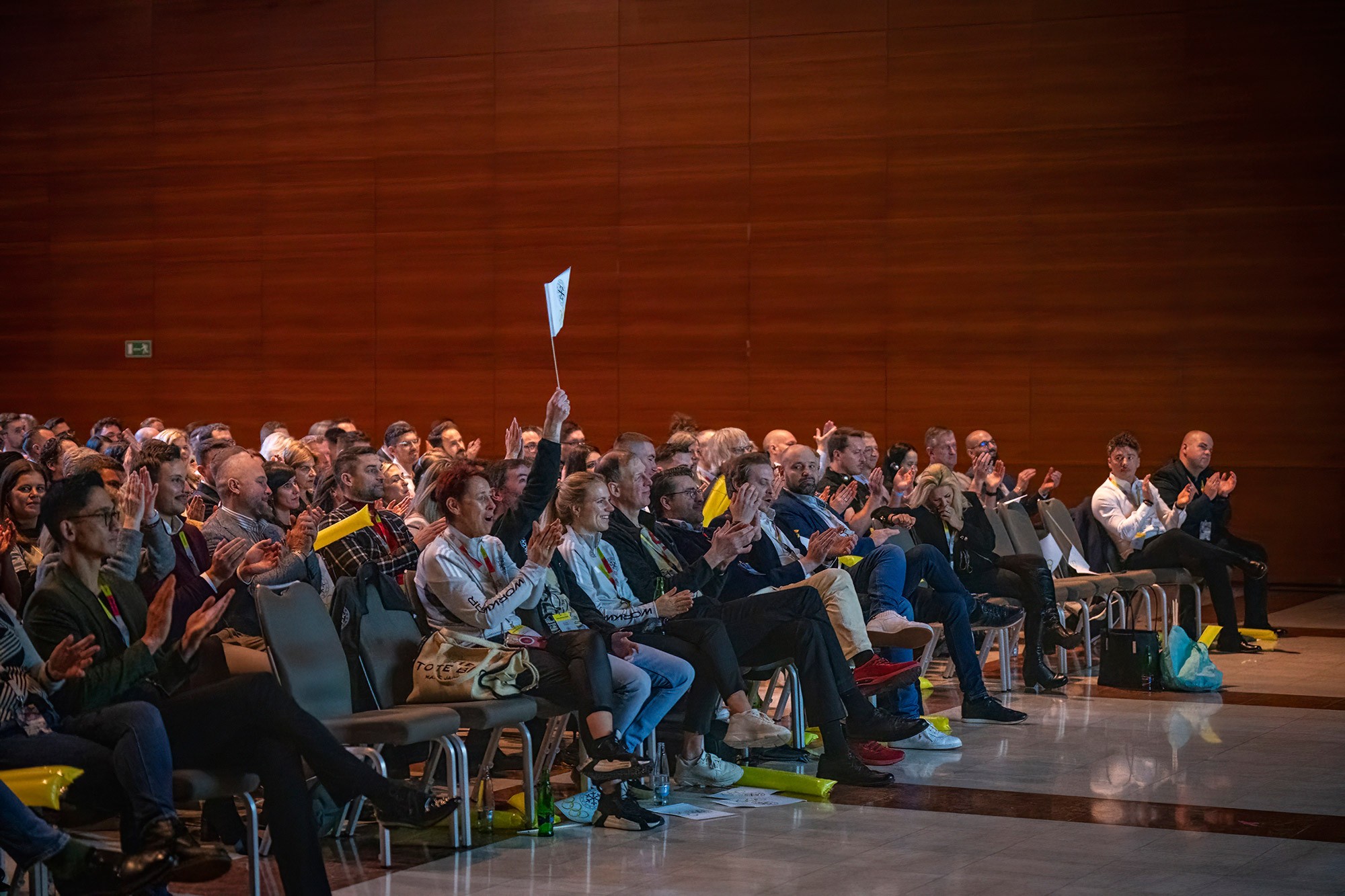 Audience applauding during the CWS Workwear sales kickoff conference in Prague, capturing the energy and engagement of the corporate event.