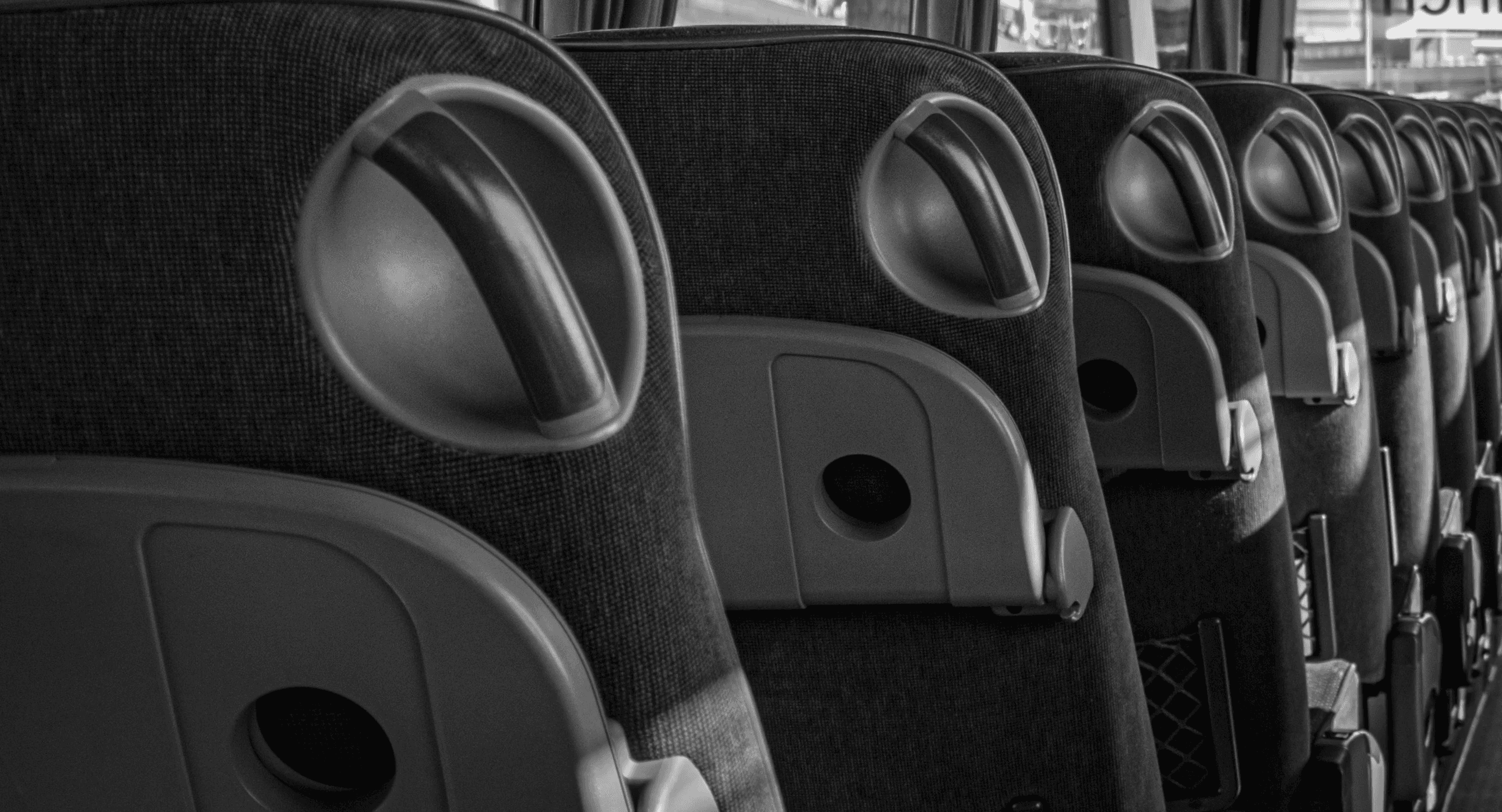 a black and white photo of the inside of a bus