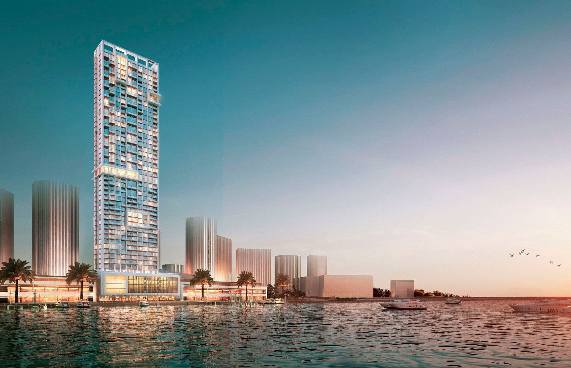 Sunset view of Anwa Omniyat tower reflected in the water, showcasing its silhouette against a colorful sky.