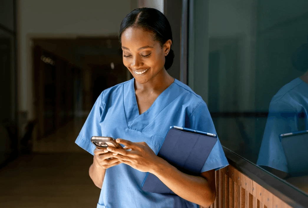Nurse looking at smart phone