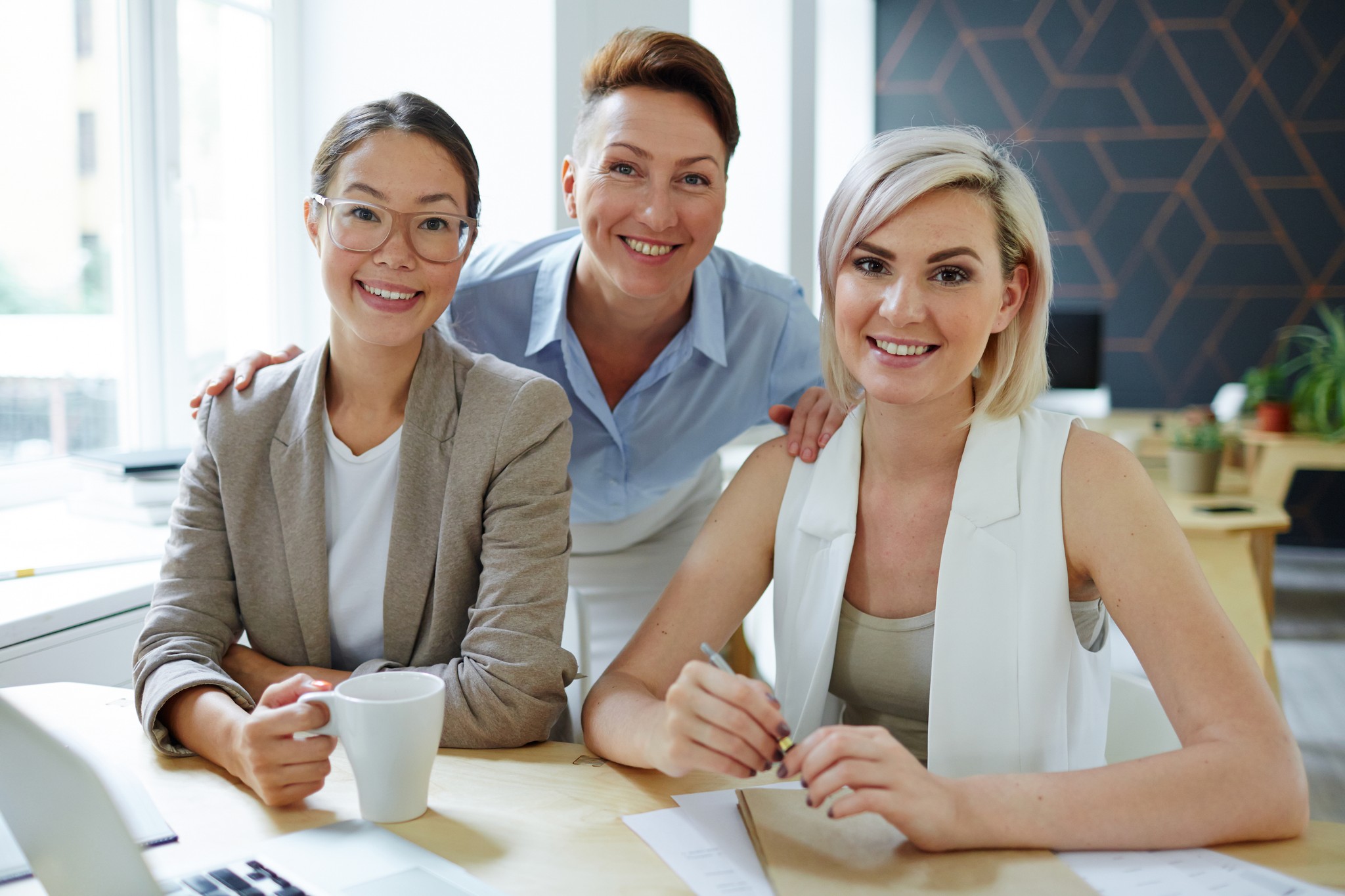 Cheerful Women Working Together in an Office Setting