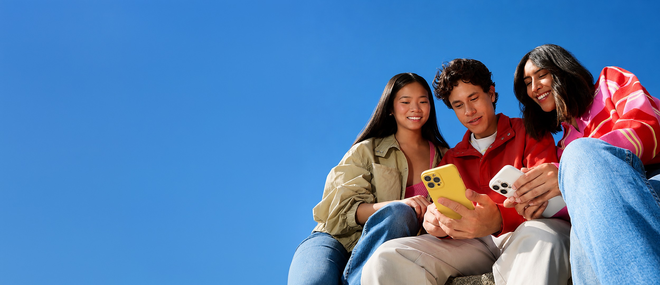 kids lying on a glass land and smiling