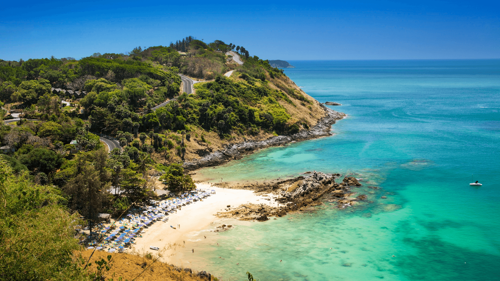 Phuket is famous for its breathtaking beaches, each offering a unique atmosphere and experience. Whether you’re in the mood for relaxation, adventure, or a lively social scene, there’s a beach. Here are some of the must-visit beaches in Phuket in 2025: 1. Freedom Beach – A Secluded Paradise One of Phuket’s most beautiful yet lesser-known beaches, Freedom Beach offers powdery white sand and crystal-clear waters. Nestled between lush green hills, it provides a peaceful retreat away from the crowds. Accessible only by boat or a steep jungle path, this hidden gem is perfect for sunbathing, swimming, and unwinding in nature. 2. Banana Beach – A Hidden Escape If you’re looking for a quiet beach with stunning turquoise waters, Banana Beach is the perfect choice. Tucked away on the northern part of the island, it remains relatively uncrowded and is an excellent spot for swimming and snorkeling. Grab a fresh coconut from the beachfront restaurant and enjoy the laid-back vibe. 3. Paradise Beach – The Ultimate Social Spot Paradise Beach lives up to its name with soft sand, clear waters, and a lively atmosphere. This beach is known for its famous Paradise Beach Club, where visitors can relax during the day and enjoy vibrant beach parties at night. It’s a great place to meet fellow travelers while soaking up the tropical sun. 4. Kata Beach – A Surfer’s Haven If you’re looking for a mix of adventure and relaxation, Kata Beach is a great option. It offers excellent waves for surfing, especially between May and October. There are also plenty of beachside restaurants and bars where you can unwind with a cocktail while watching the sunset. 5. Patong Beach – The Lively Hub As Phuket’s most famous and busiest beach, Patong is where all the action happens. Here, you’ll find an array of activities, from jet skiing and parasailing to beachfront bars and restaurants. It’s also just steps away from Bangla Road, Phuket’s nightlife hotspot, making it a great place to start your evening after a day in the sun. Each of these beaches has something special to offer, whether you’re seeking tranquility, adventure, or a lively social experience. Experience Adventure & Outdoor Thrills Phuket is not just about relaxing on beautiful beaches—it’s also a playground for adventure lovers. Whether you’re looking to explore stunning landscapes, get your adrenaline pumping, or take part in unique outdoor activities, the island offers a range of thrilling experiences. 1. Island-Hopping Tours – Explore Thailand’s Best Islands