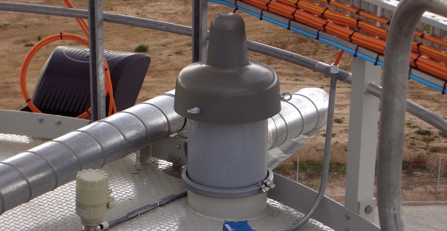 Orange vibration motor with silver end caps and connector cable.
