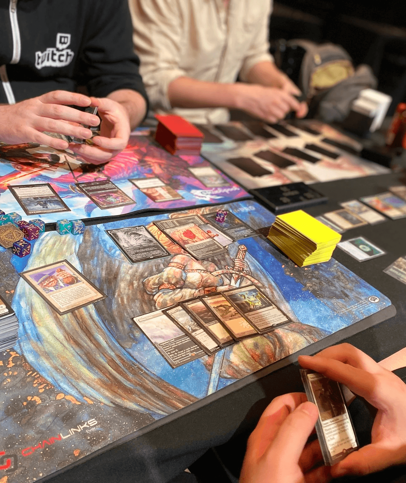 magic the gathering players with cards on desk