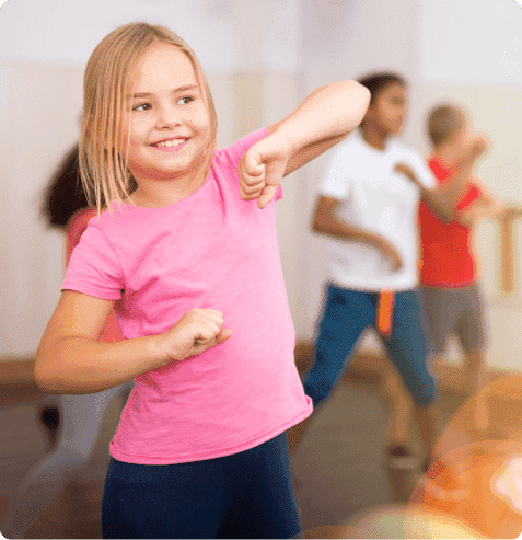 Students performing dynamic jazz funk choreography in after school dance enrichment program