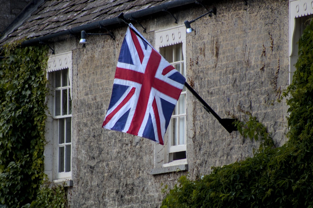 The union jack flies outside a building.