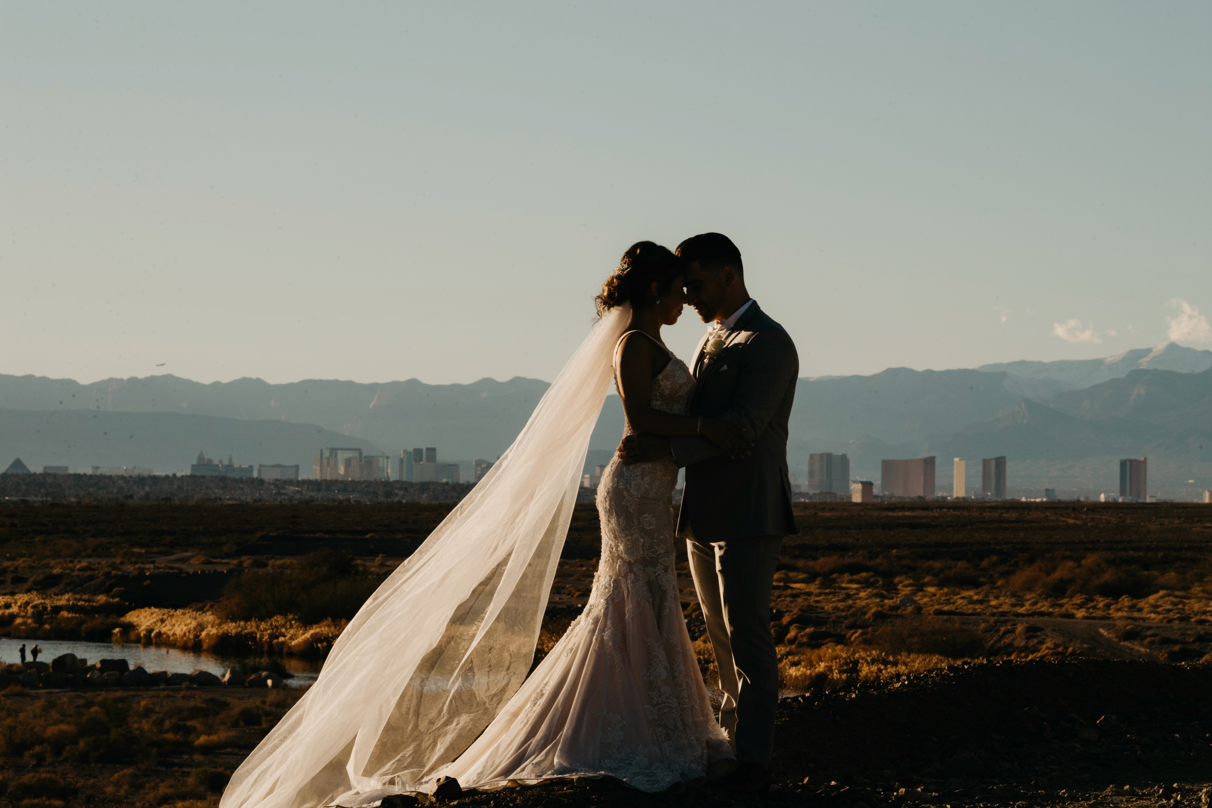 Bride and groom wedding photos with Las Vegas skyline in the background