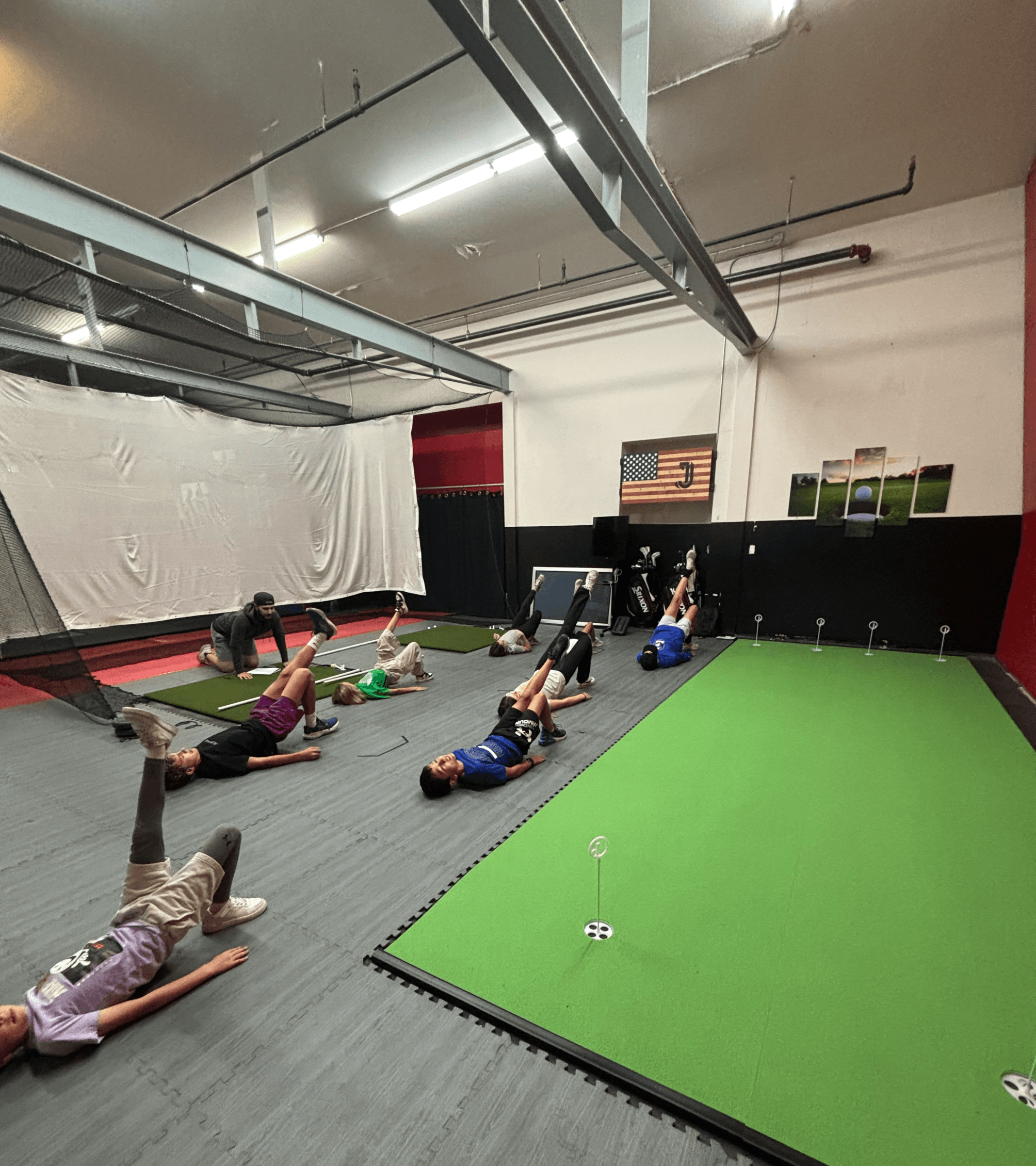 Jack running students through exercises at an indoor facility.