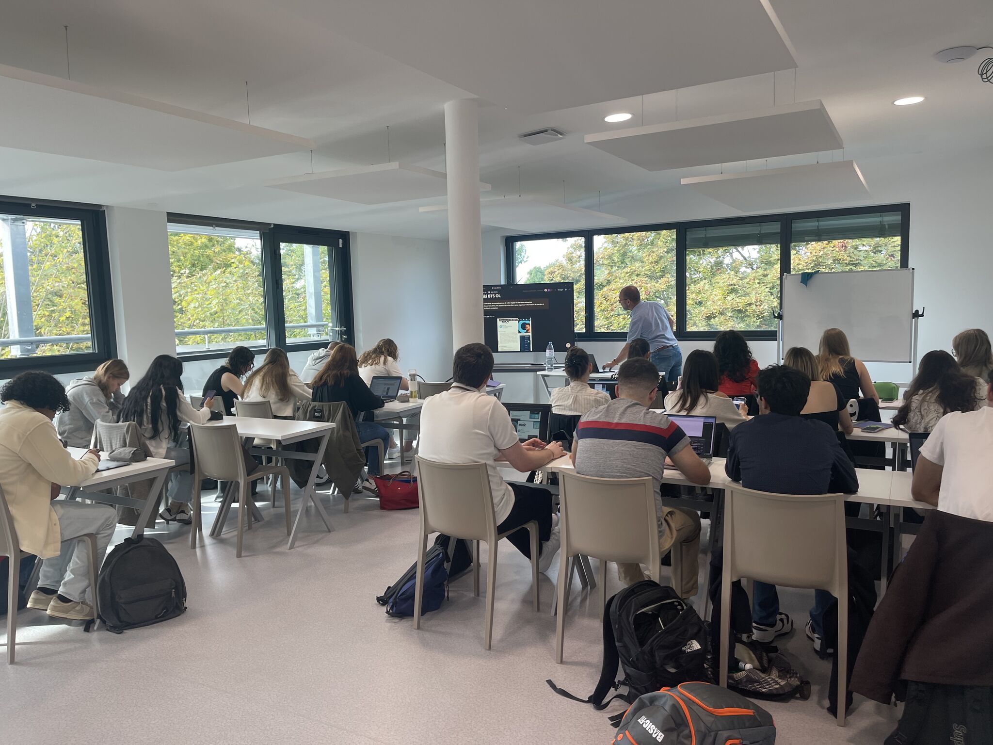 woman in orange tank top and blue denim shorts wearing black sunglasses