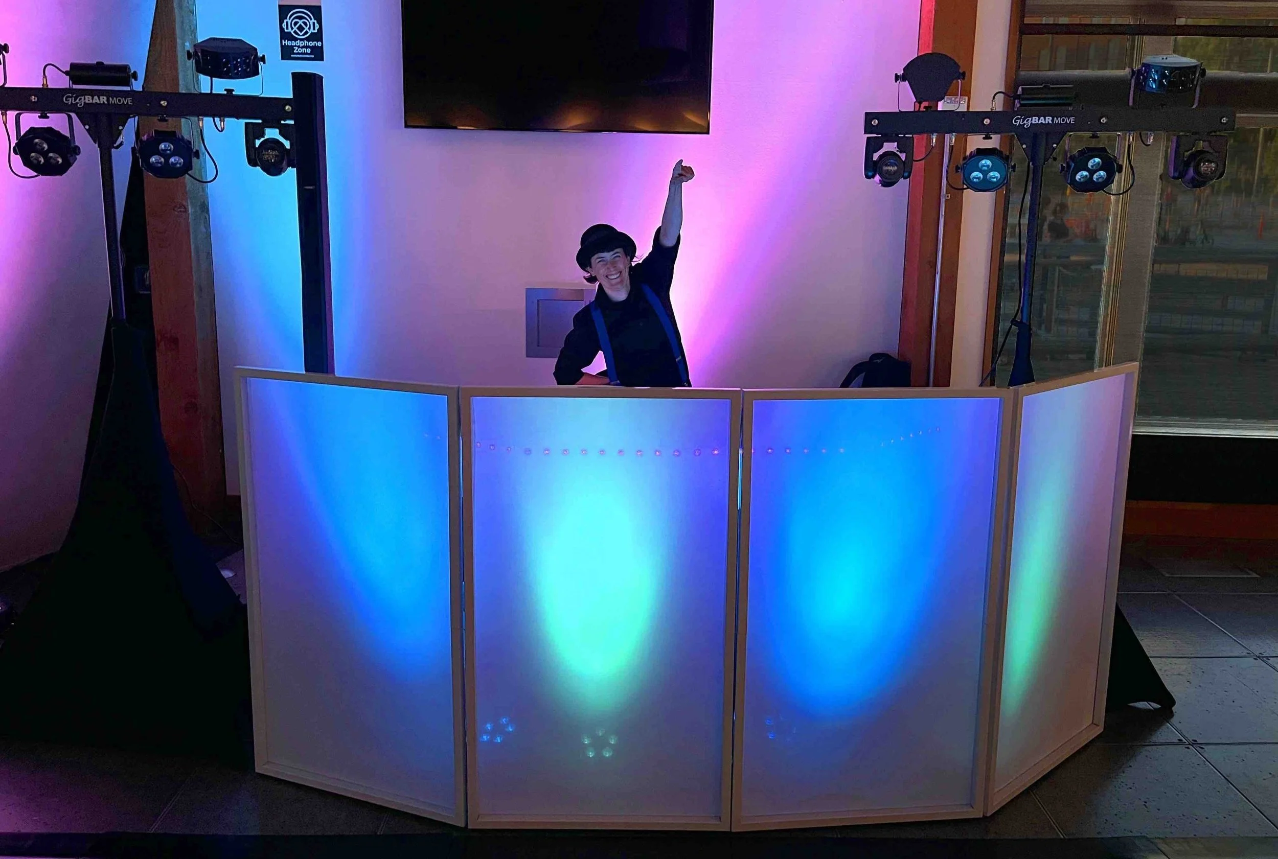DJ Kelli handling the wedding MC role Seattle couples book, making a dinner announcement at a reception