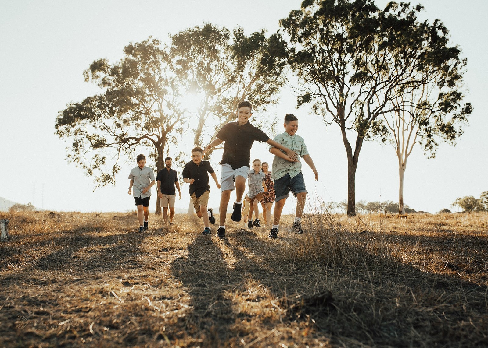 Ross with his children in an the FNQ outback farm setting, highlighting family and rural lifestyle