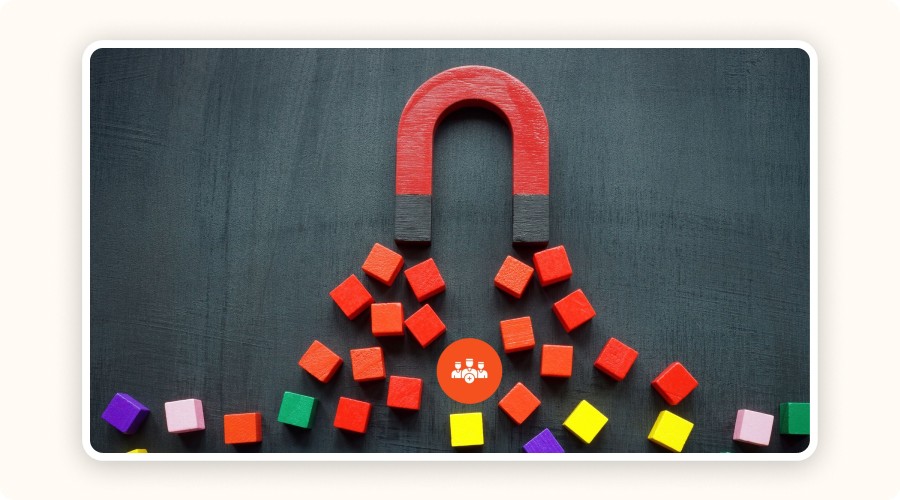 Red U-shaped magnet attracting colored cubes