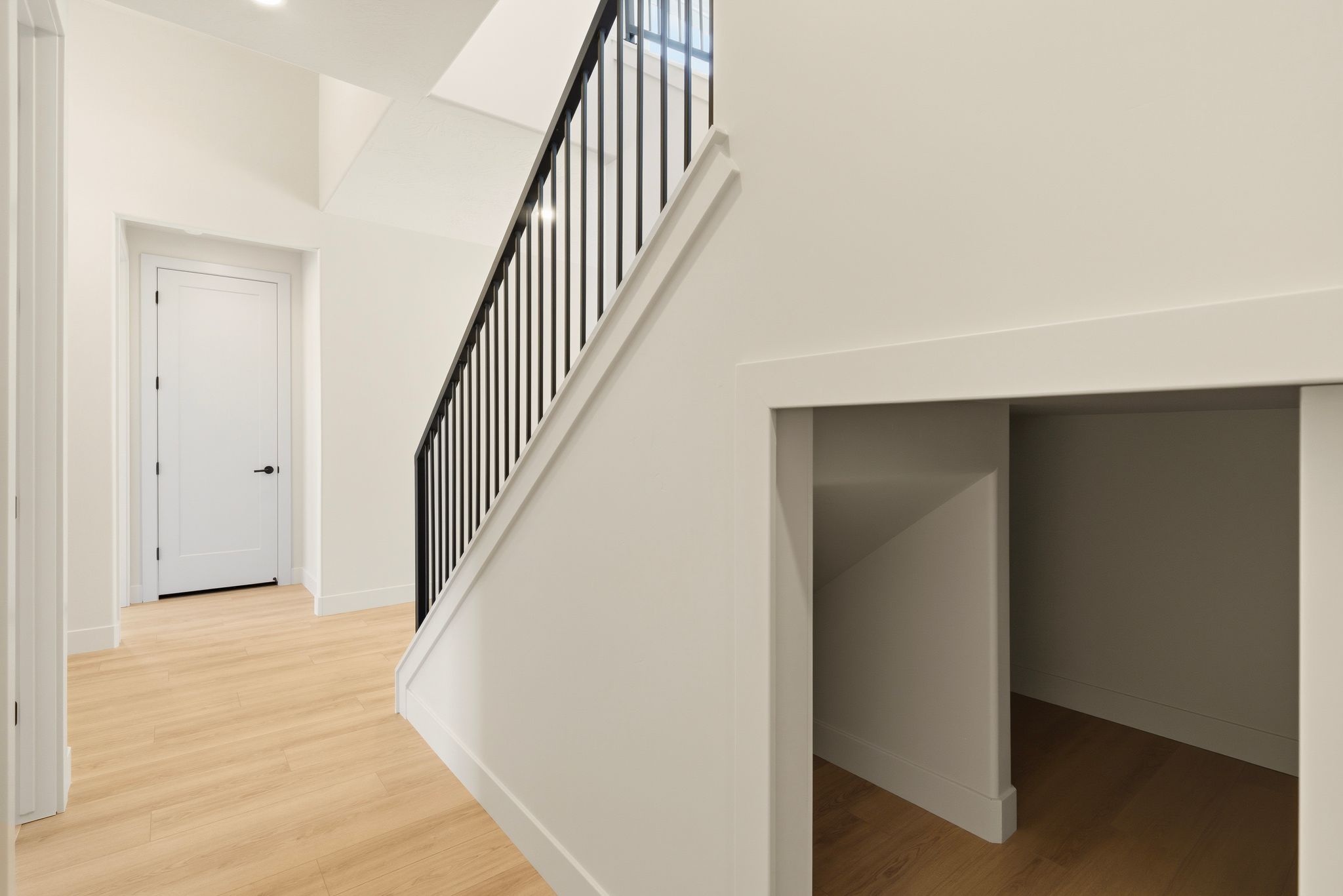 Hidden under-stairs storage at The View at Falcon Ridge in Hurricane, Utah, providing functional space while keeping the home organized.