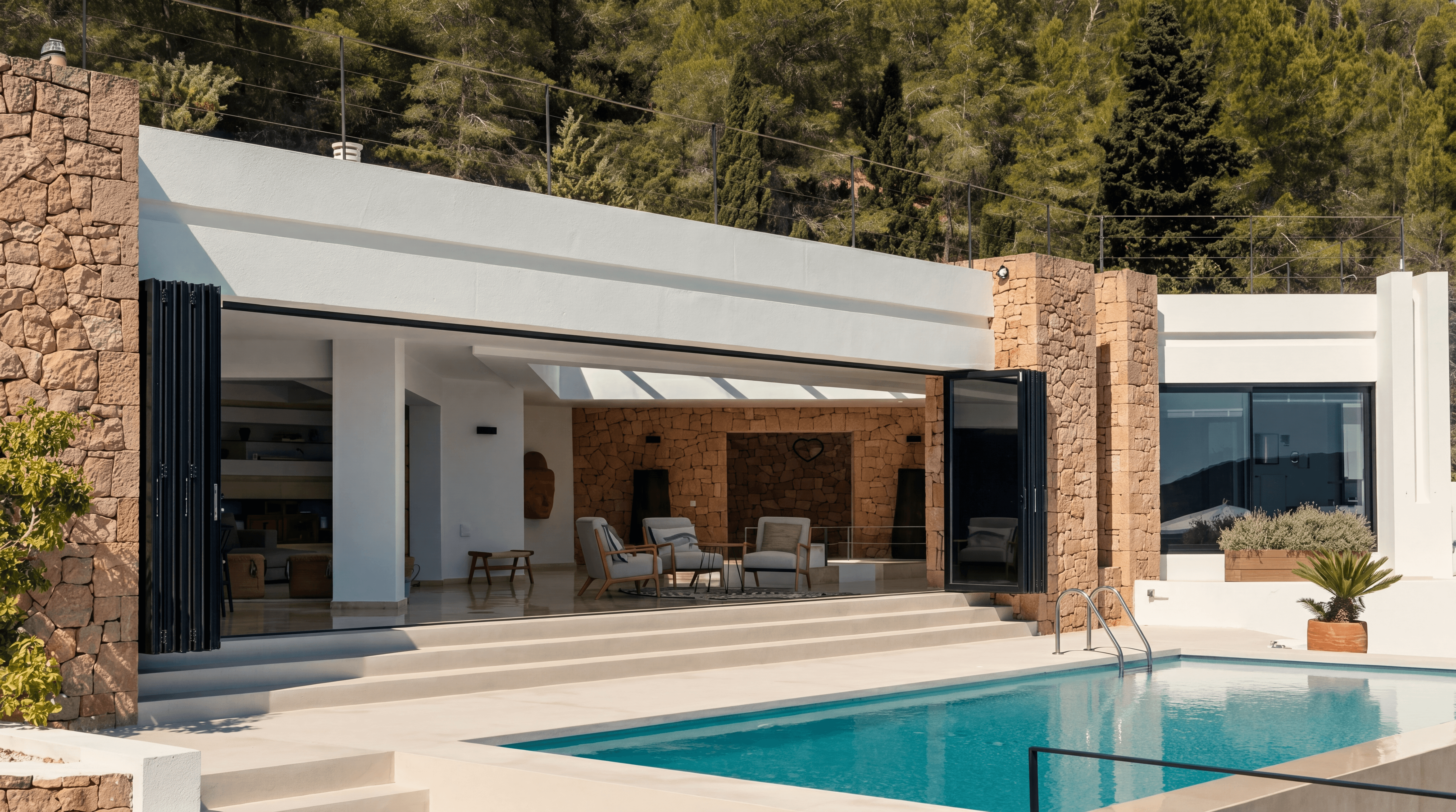 Private villa with infinity pool and open-plan living set into pine hillside, Ibiza, Spain — curated by VELUMA Private Residences
