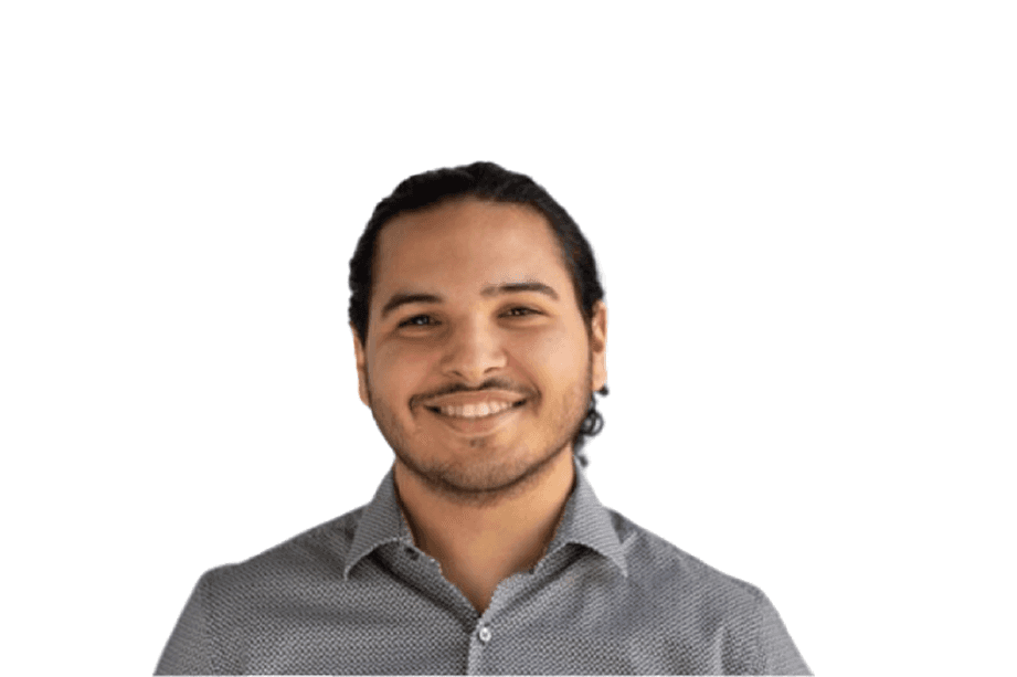 A thoughtful young person with dark hair gazes to the side, captured in soft black and white lighting.