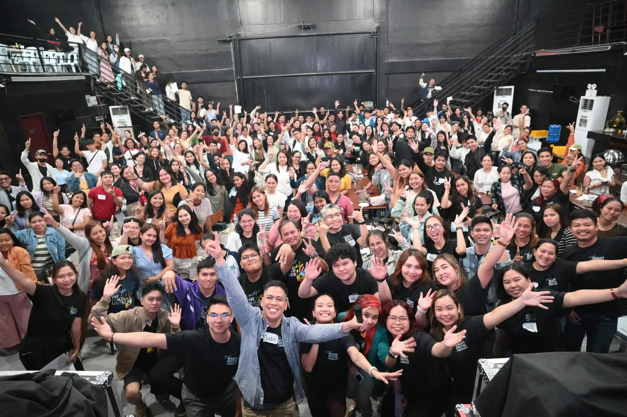 a person sitting at a desk with a laptop and a cell phone