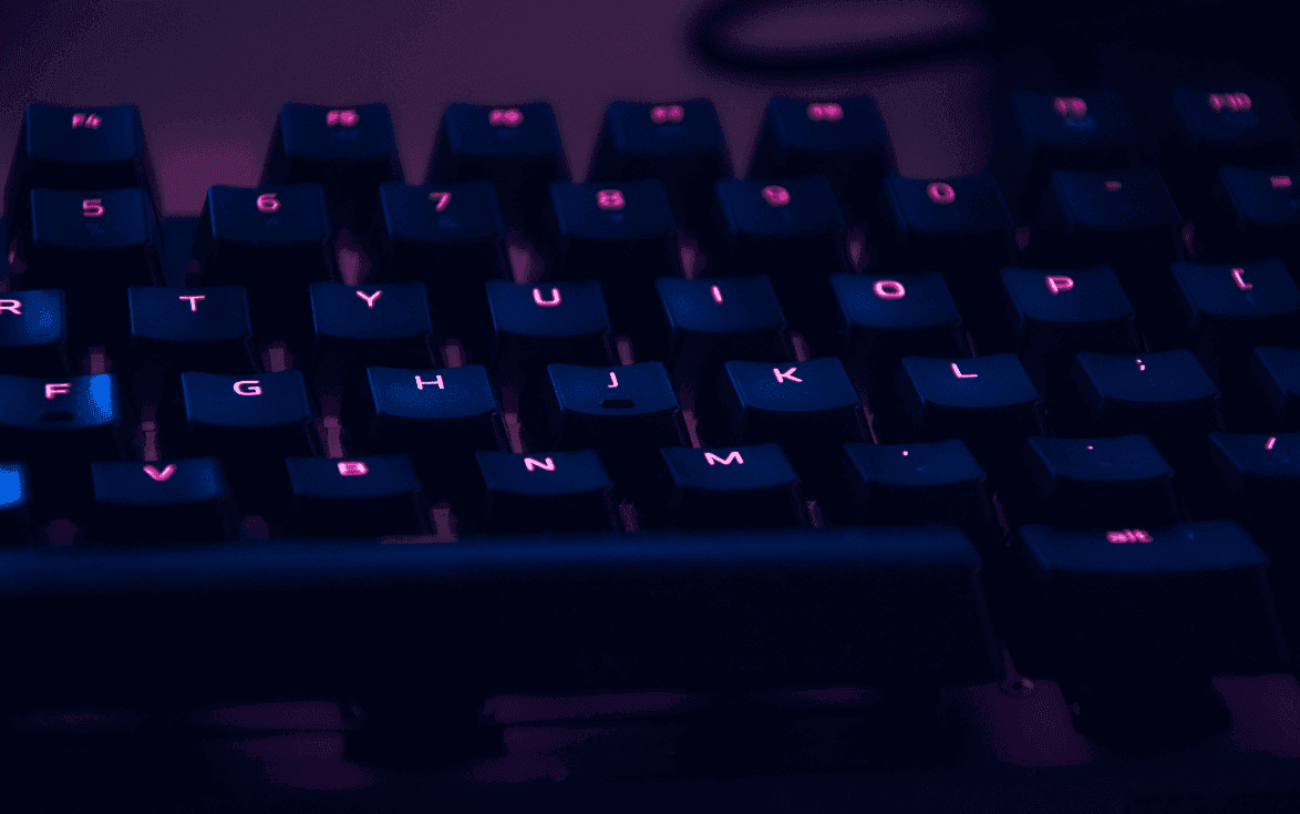 RBG keyboard shining in purple-punk color in the dark