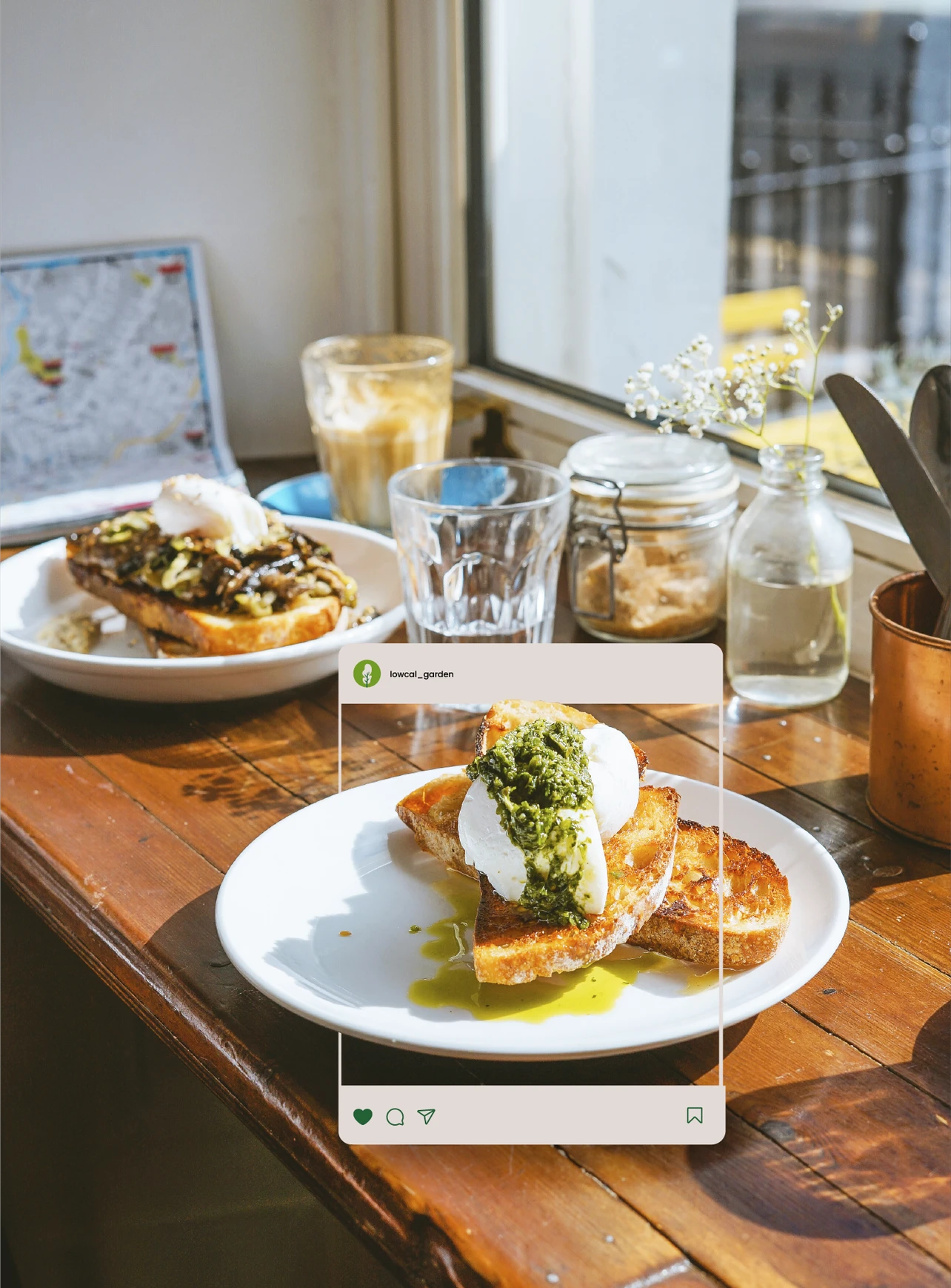 Lowcal Garden Instagram post mockup — poached egg and pesto on sourdough toast overlaid on cozy café table scene with iced latte and baby's breath flowers — social media content and food photography by Makers' Studio