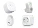 A smart plug in a wall outlet with a phone showing energy usage