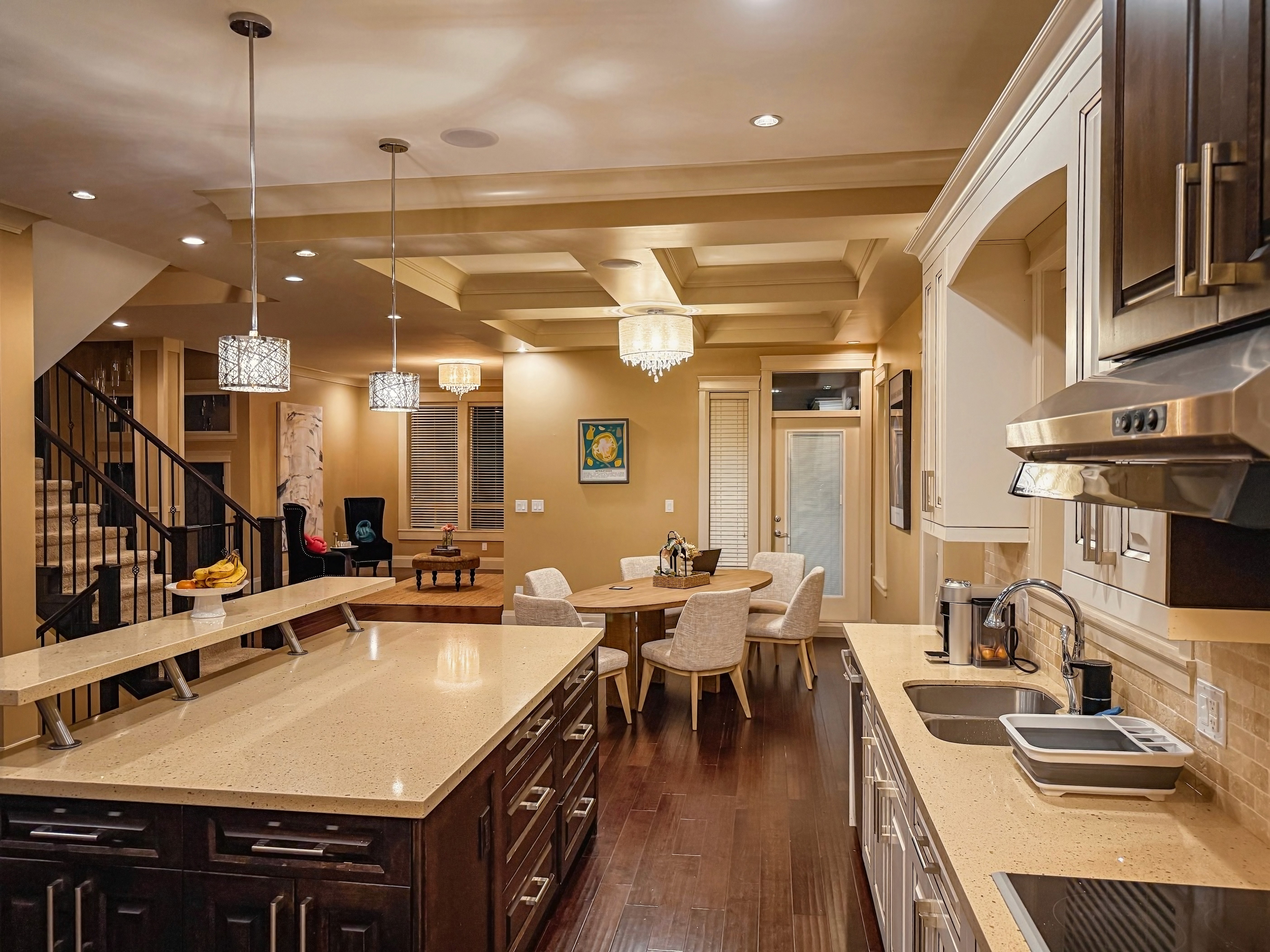 a group of young children riding skis down a snow covered slope