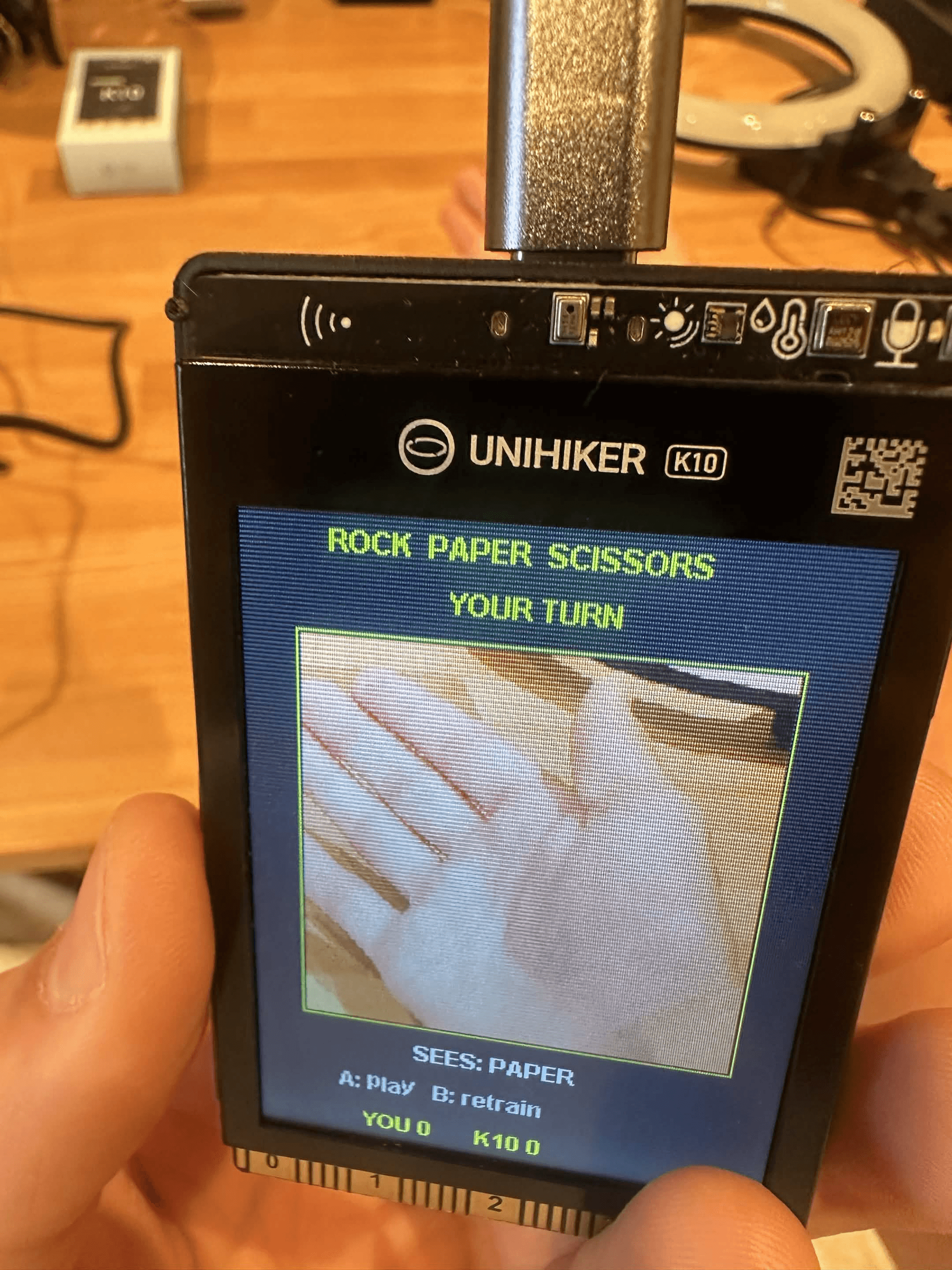 AI rock paper scissors project running on the UNIHIKER K10 with camera-based hand gesture detection.