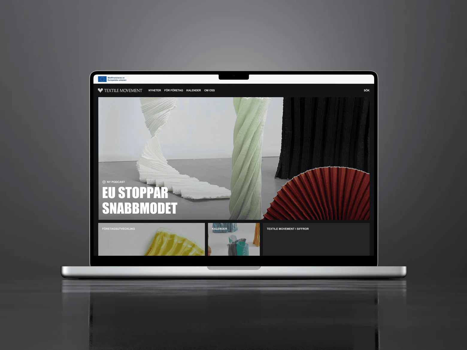 Laptop som visar Textile Movements startsida med rubriken EU stoppar snabbmodet
