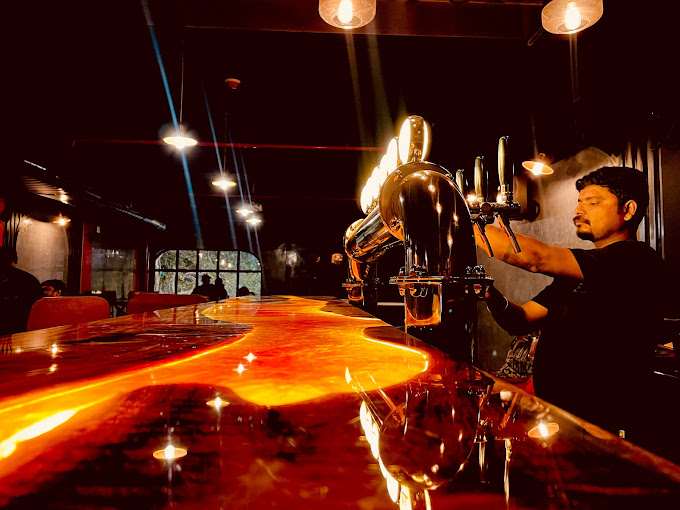 Bartender pouring a beer.