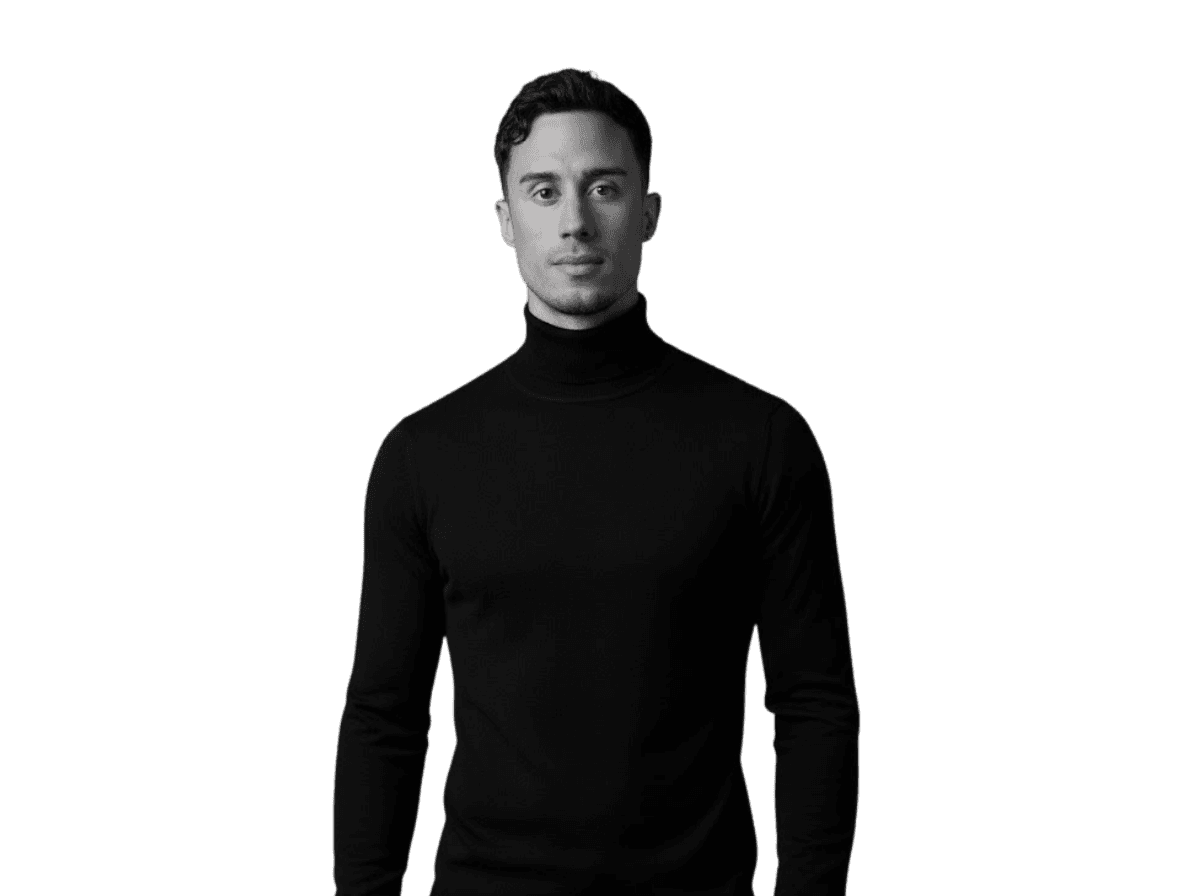 Professional woman in a suit standing in an office setting.