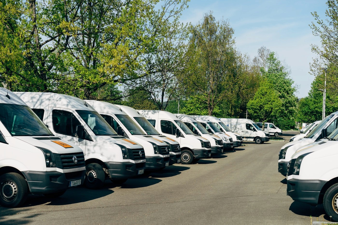 Row of white transport vans