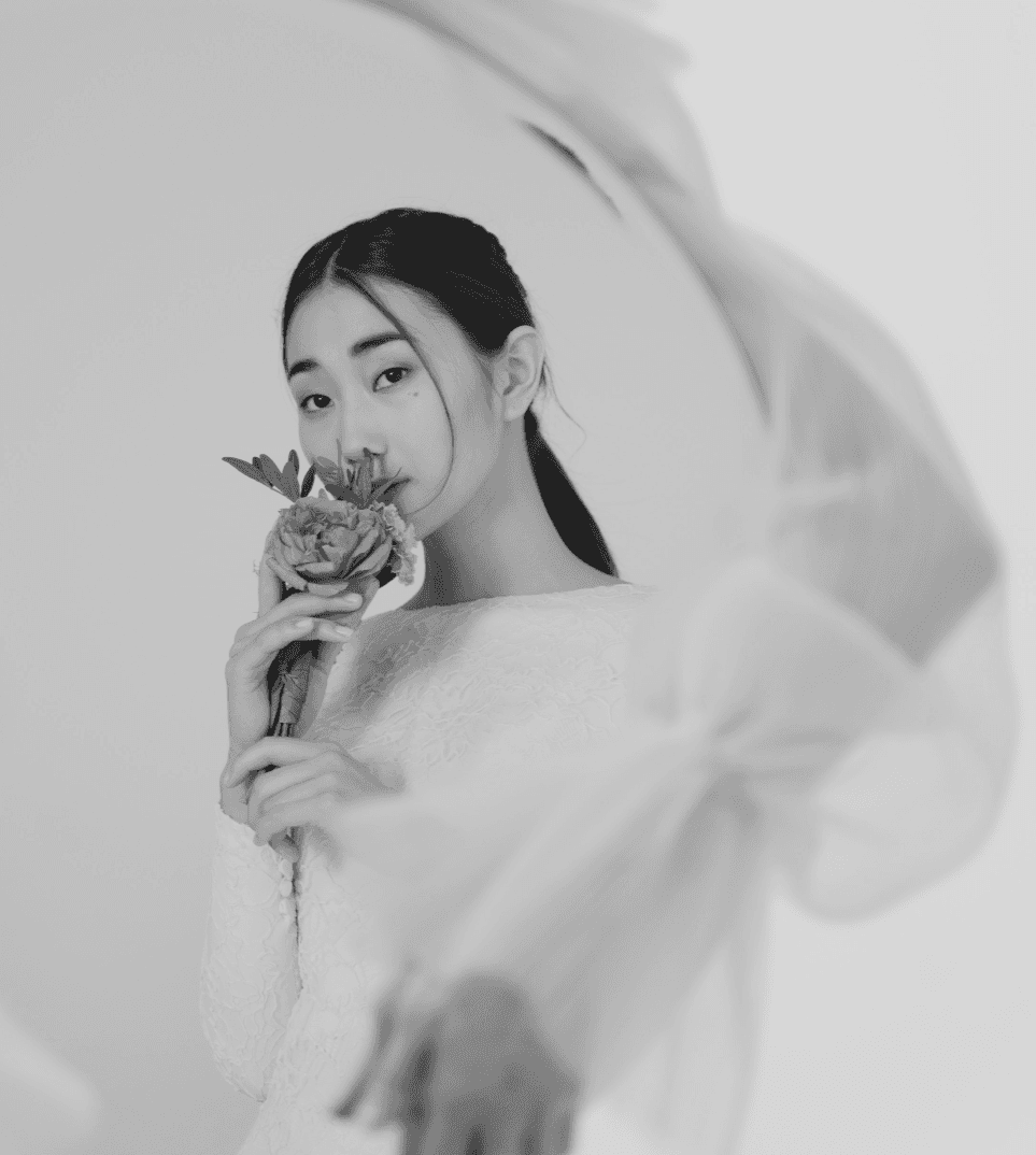 a woman holding a flower