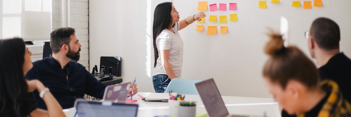 Strategic planning session with sticky notes and charts