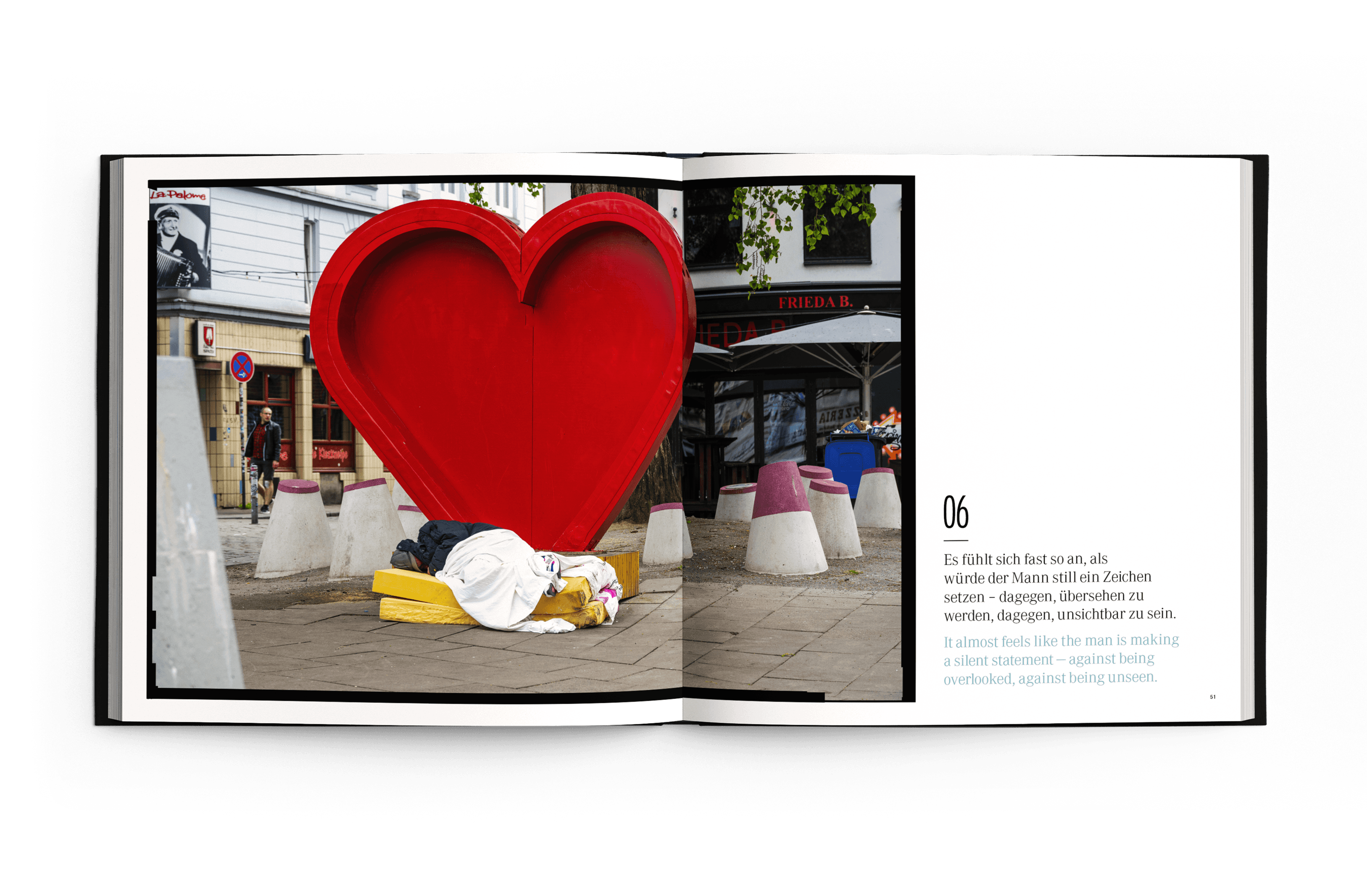 Moments of Life Sample Page, Photo of a Heart-shaped display with a homeless man sleeping beneath it