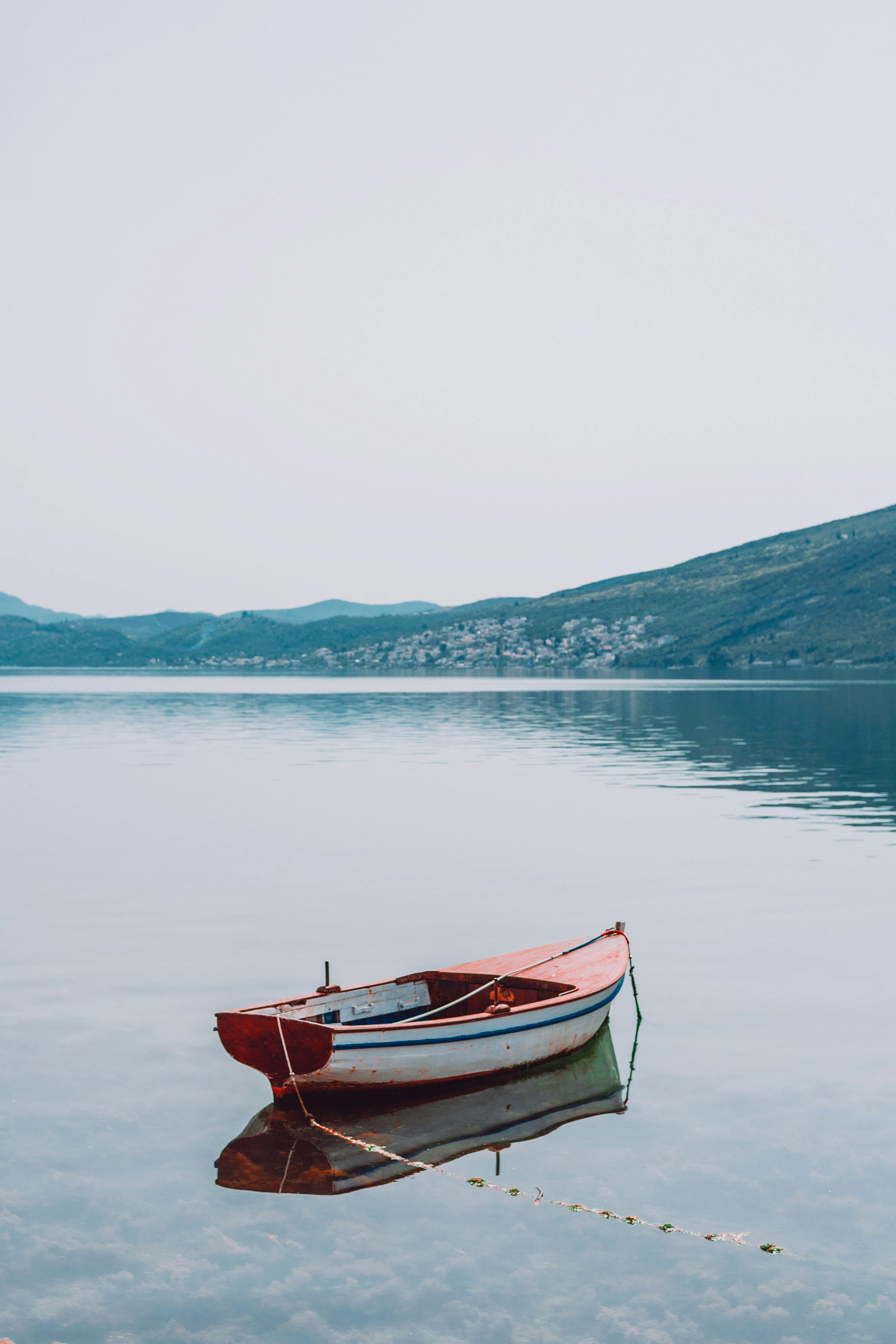 Photo by Maria Orlova: https://www.pexels.com/photo/small-moored-boat-on-peaceful-lake-in-highlands-4946412/