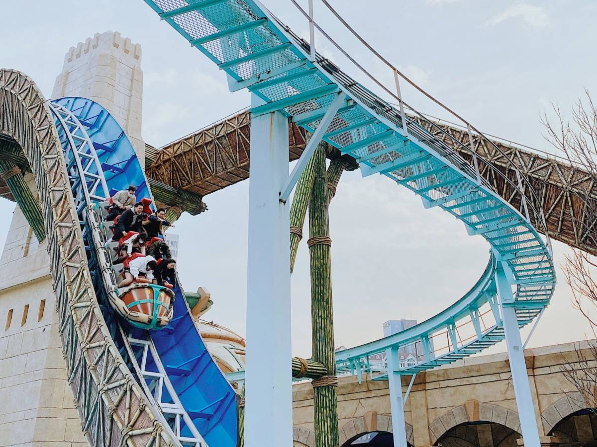 three brown wooden boat on blue lake water taken at daytime