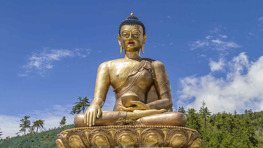 a view of a city and mountains from a distance