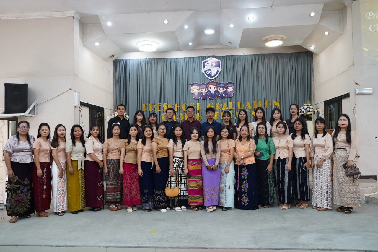 Faculty of Elpis International School gathered in front of the school campus in Yangon, Myanmar