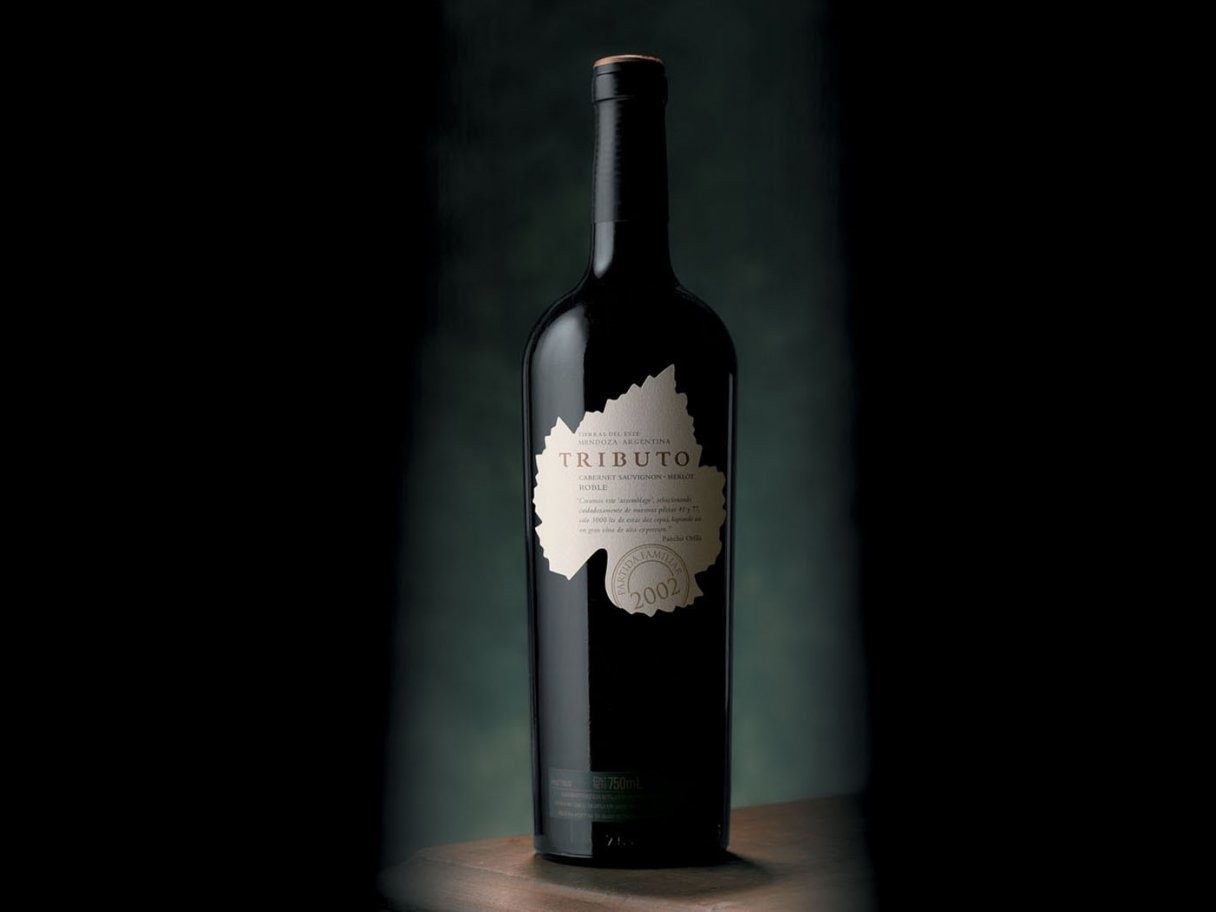 Rustic cabin in a golden field at sunset