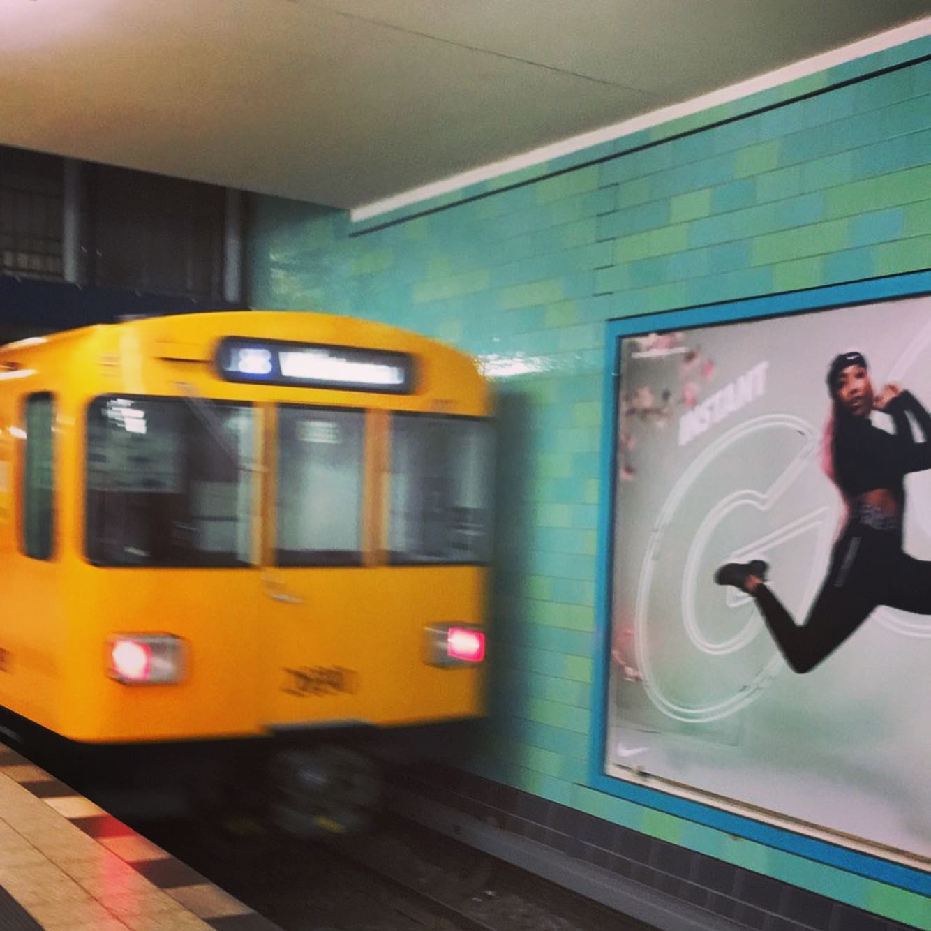 a group of people walking on a sidewalk