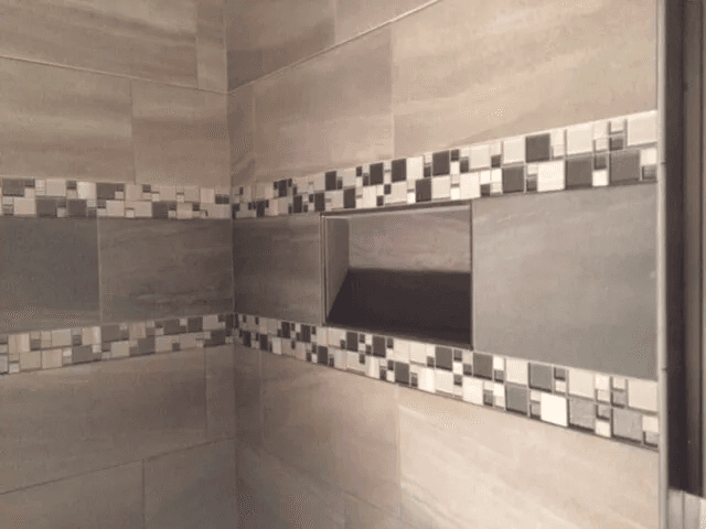 Elegant shower tile installation by Shilling's Carpets & Floors