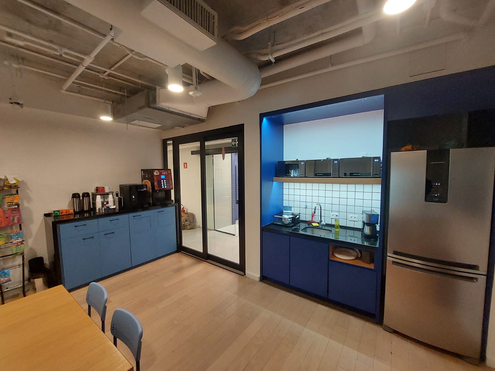 Contemporary interior with sculpted angled walls and a skylight filling the space with natural light.